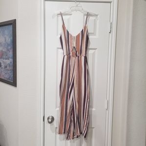 Optical illusion elongating vertical striped jumpsuit center diamond cutout